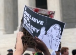 Feminists support alleged sexual assault victim Christine Blasey Ford in protest outside the Supreme Court after Brett Kavanaugh's confirmation